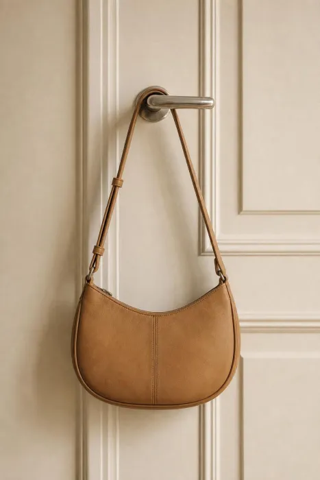 A tan leather shoulder bag