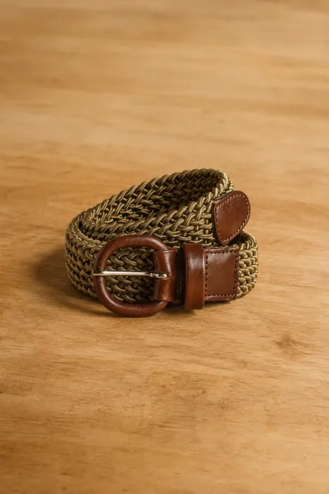 A woven belt with a leather buckle